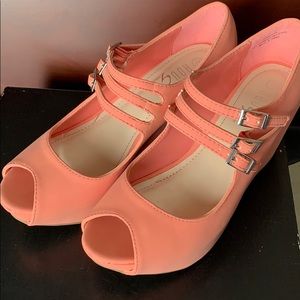 Peach three-strap buckle wedges